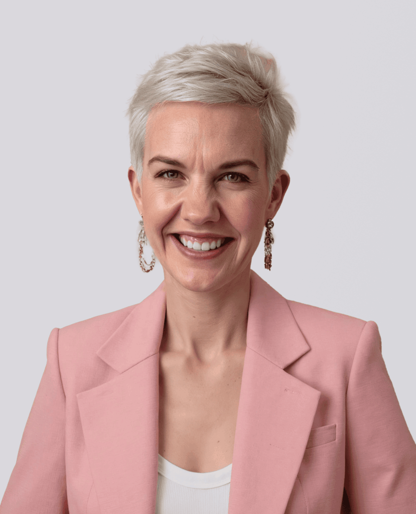 Professional Headshot of a smiling woman in a pink blazer