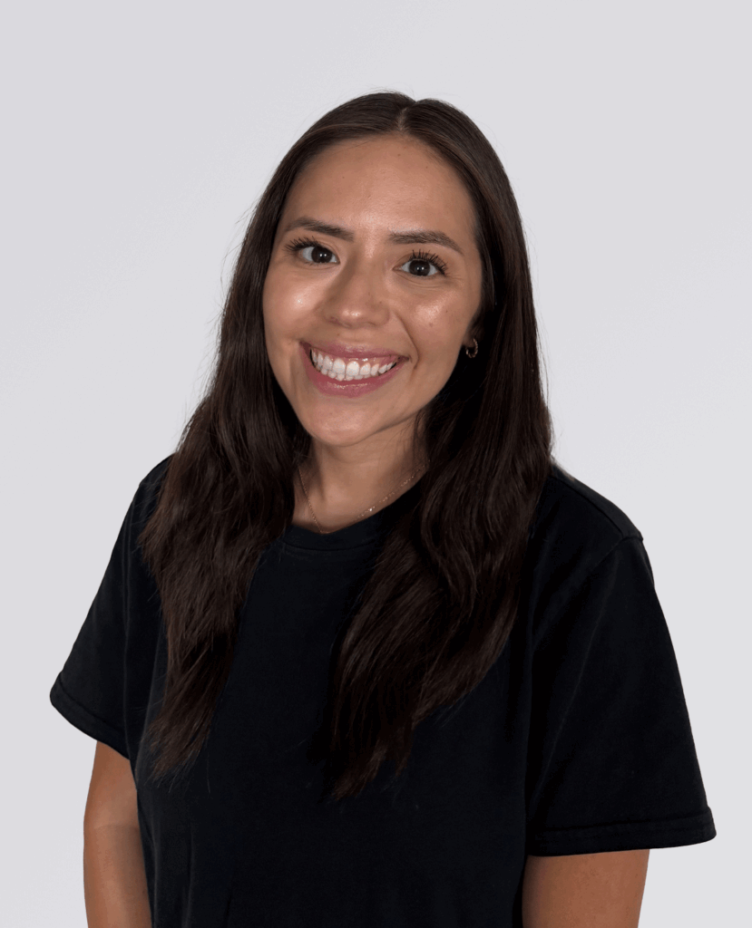 Professional smiling headshot of a women smiling in a black shirt