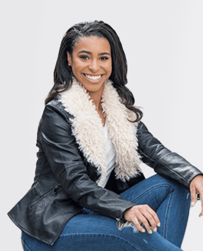 Professional headshot of a smiling women in a black jacket